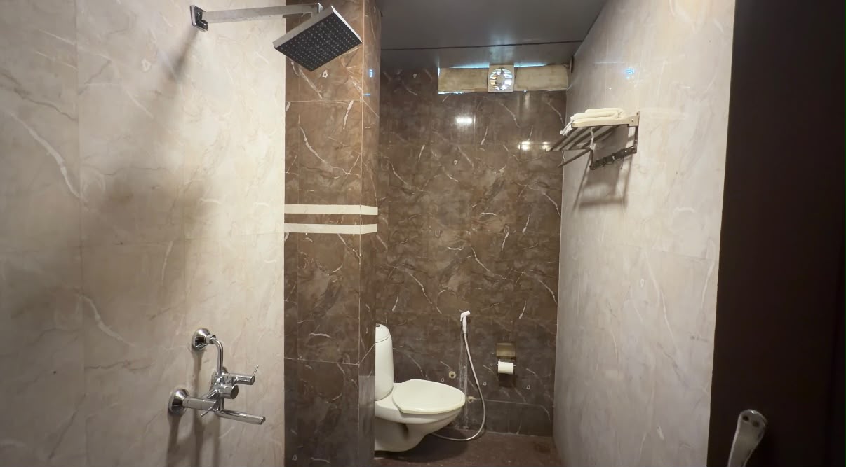 Private attached bathroom in Deluxe Double Bed Room at Hotel Tara Palace